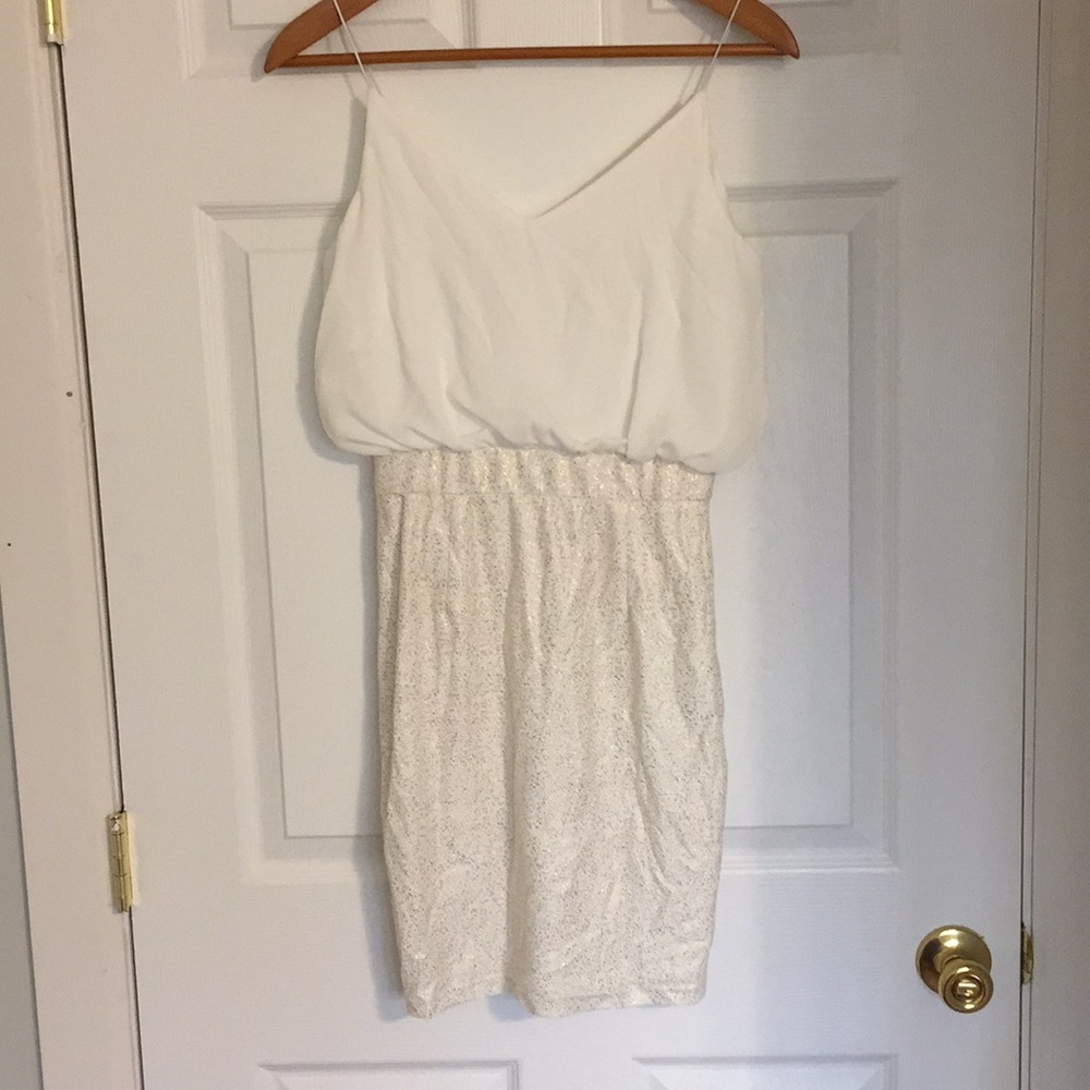 White and gold mini dress, flowy top.